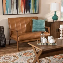 Nikko Mid-Century Faux Leather Upholstered Wood Loveseat Walnut/Brown - Baxton Studio 12 Nikko Mid-Century Faux Leather Upholstered Wood Loveseat Walnut/Brown - Baxton Studio -Baxton Studio GUEST d1496ae9 9e7b 4c99 a39c b224c1b080f8